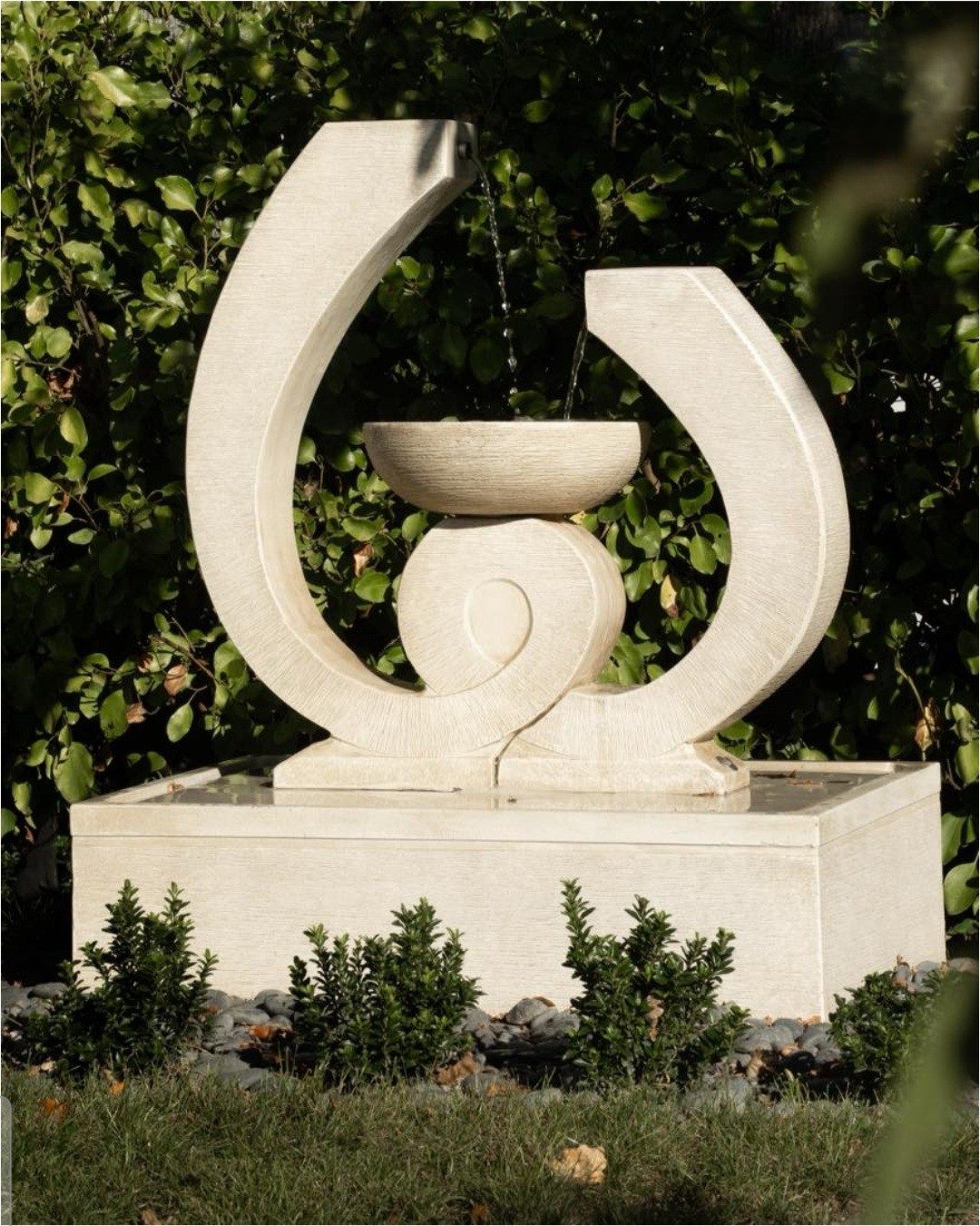 Stone water fountain in the Seven Oaks grounds