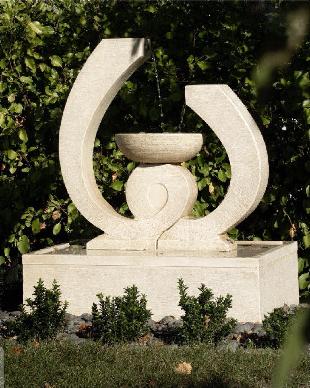 Stone water fountain in the Seven Oaks grounds